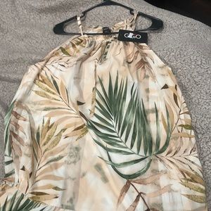 Dress beige and brown with some green never been worn selling for 18 dollars